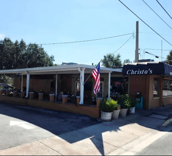 Christo's Cafe corner exterior with American flag
